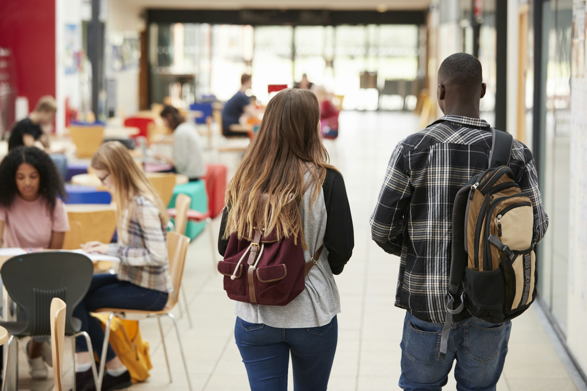 Communal Area Of Busy College Campus With Students